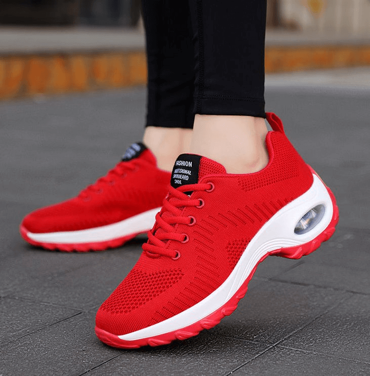 Red stylish women's sneakers SF0775 with breathable mesh and flexible sole, perfect for sports and active wear.